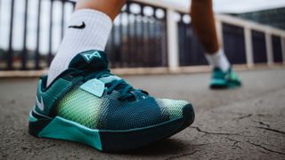 Nike Metcon 10 close up outdoors in bright green, blue