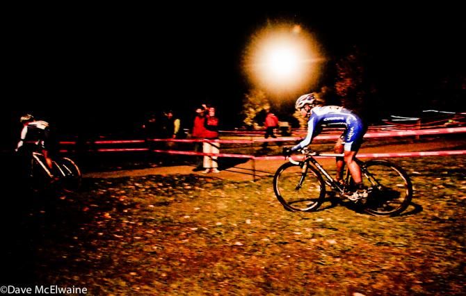 Katerina Nash (Luna Pro Team) watches Katie Compton ride off into the night