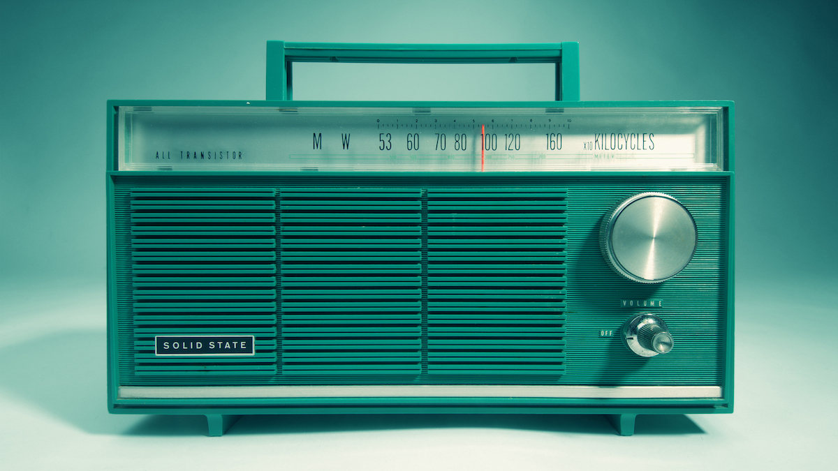 Transistor radio on a grey-green background