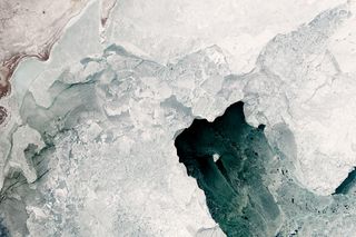 A diamond-shaped chunk of ice shines bright in this satellite image of the Caspian Sea. The image was captured on Feb. 4, 2017.