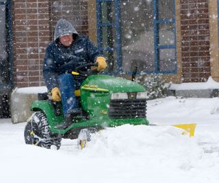 Using a lawn mower as a snow plow