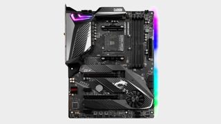 MSI MPG X570 Gaming Pro Carbon WiFi motherboard topdown view on grey background, with glowing side