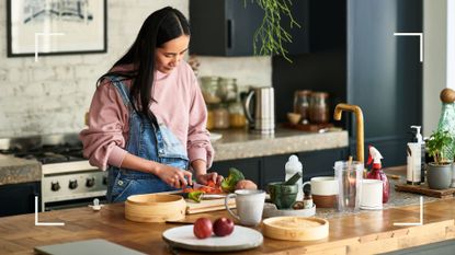 Cleaning chopping board news piece - woman using chopping board in kitchen 