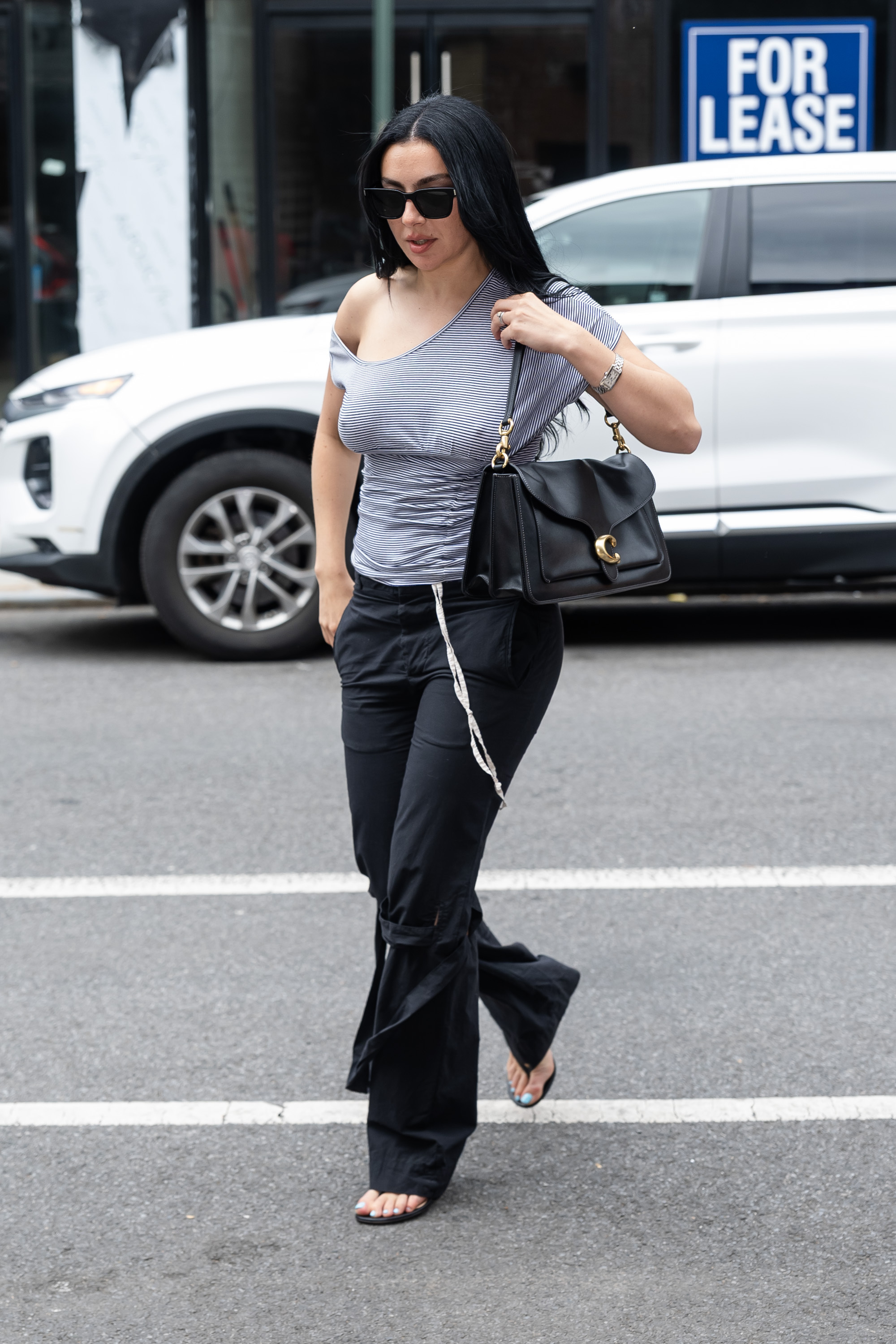 Charli xcx styled the Coach Tabby bag with another indie-sleaze outfit on July 10