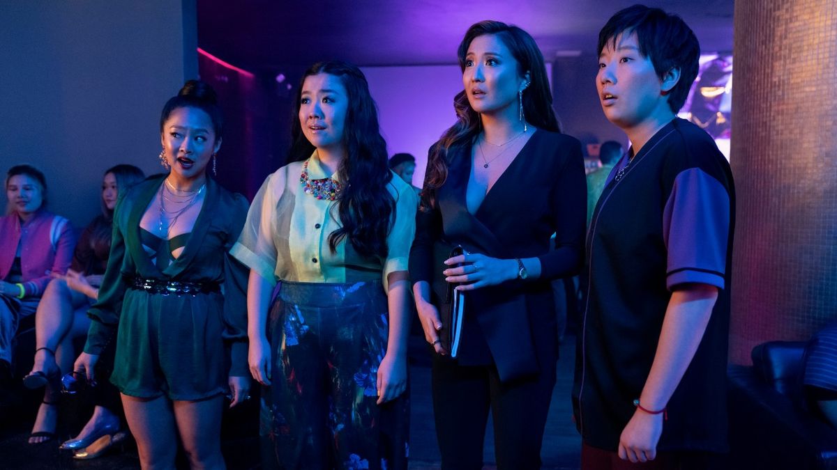 From left to right: Stephanie Hsu, Sherry Cola, Ashley Park and Sabrina Wu looking shocked in a club.