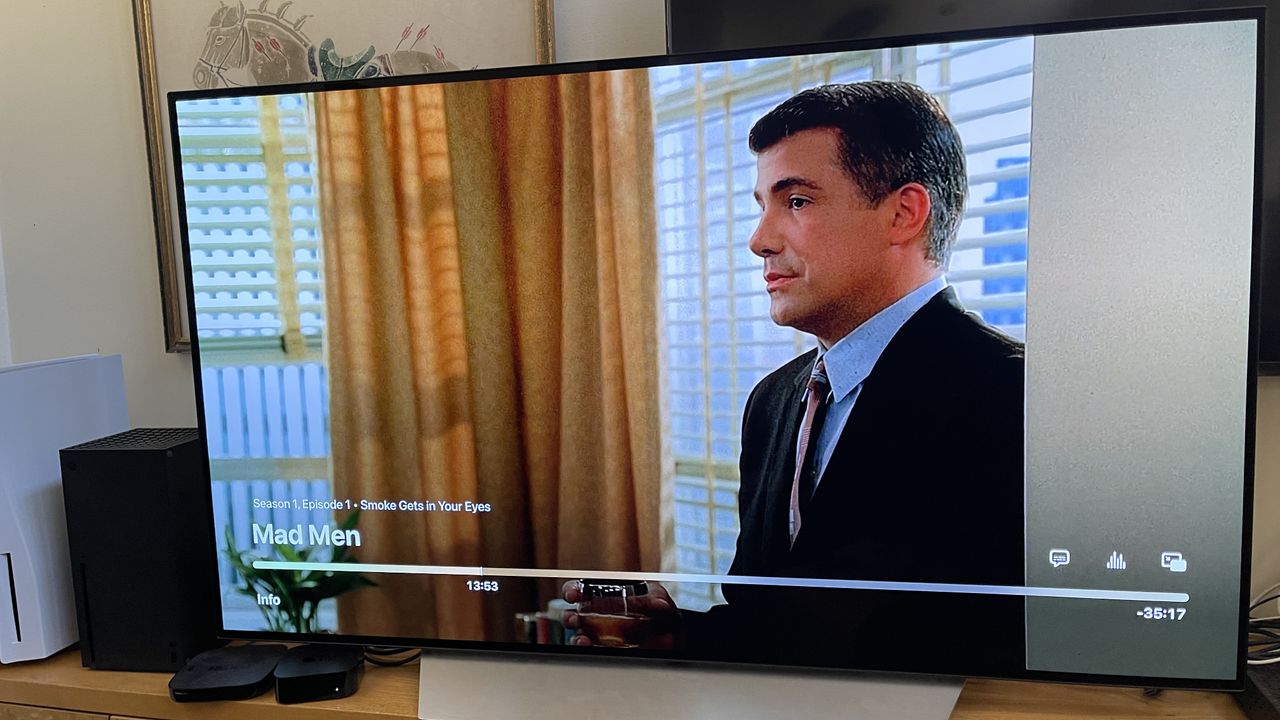 A TV with a paused episode of Mad Men in the Apple TV app