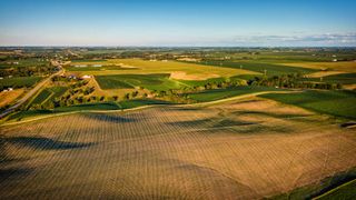 Aerial view of rolling farmlands in Iowa.