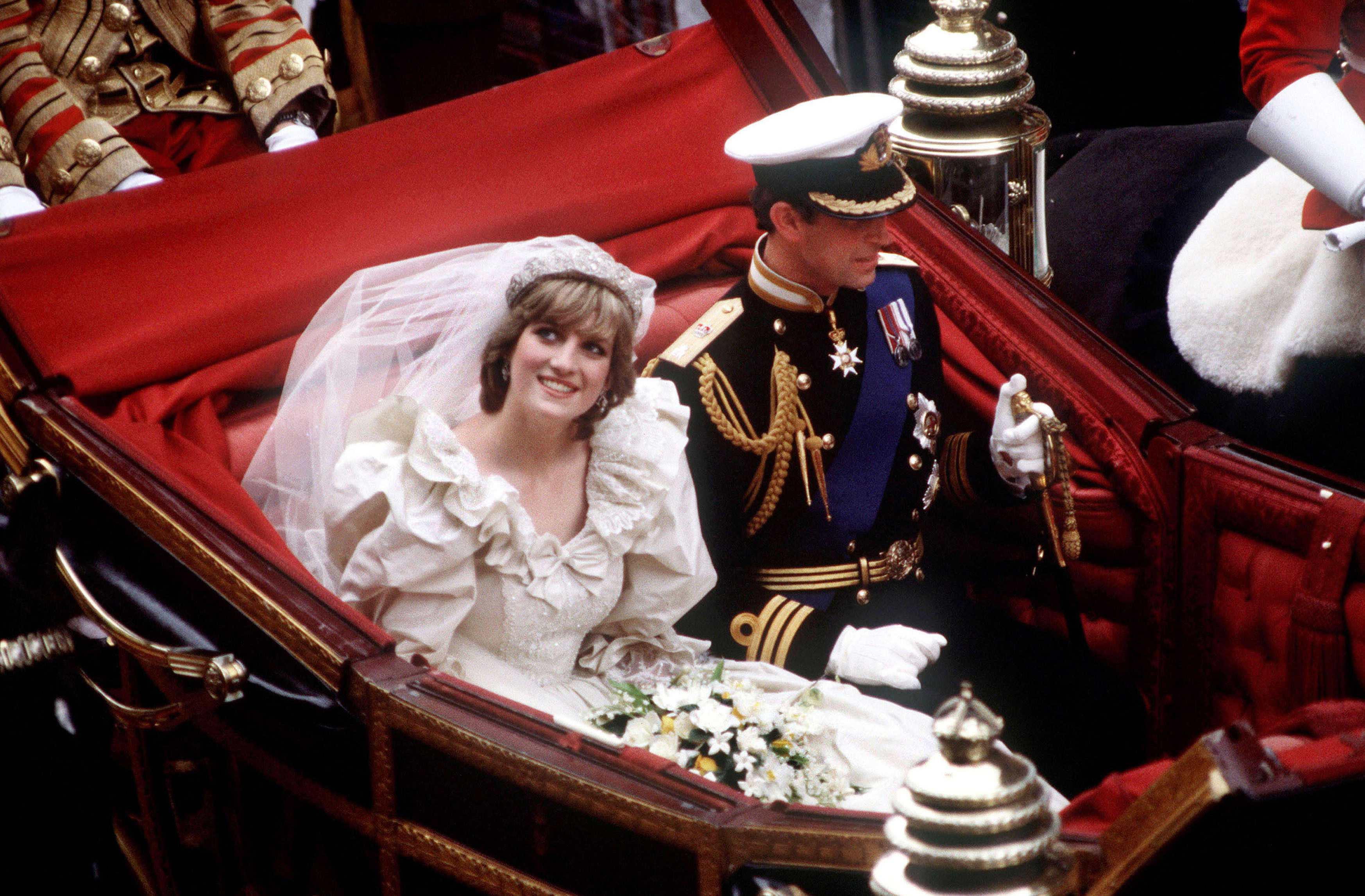 Princess Diana and Prince Charles riding in a carriage on their wedding day