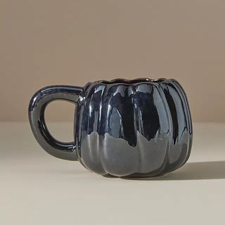 Black pumpkin-shaped mug