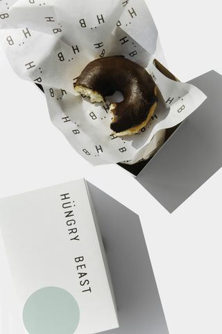 A half-eaten donut, akin to works by John Baldessari