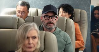 Tom Segura sitting in an airplane in Bad Thoughts