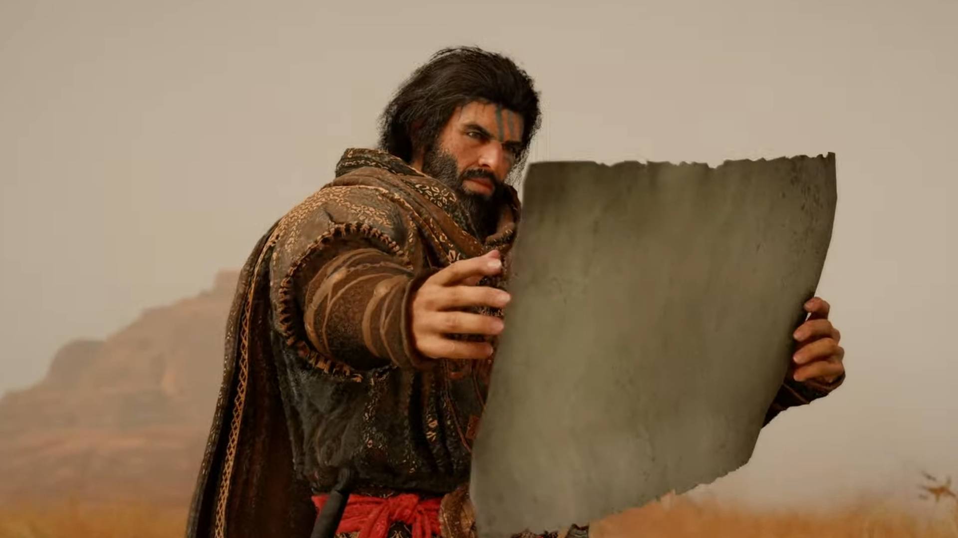 Cliff in Crimson Desert holds a map.
