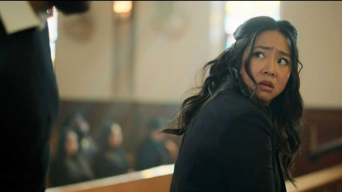 Stephanie Hsu looking at someone in a church in Laid. 