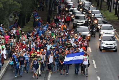 Honduran migrants lead caravan to U.S. border in October.