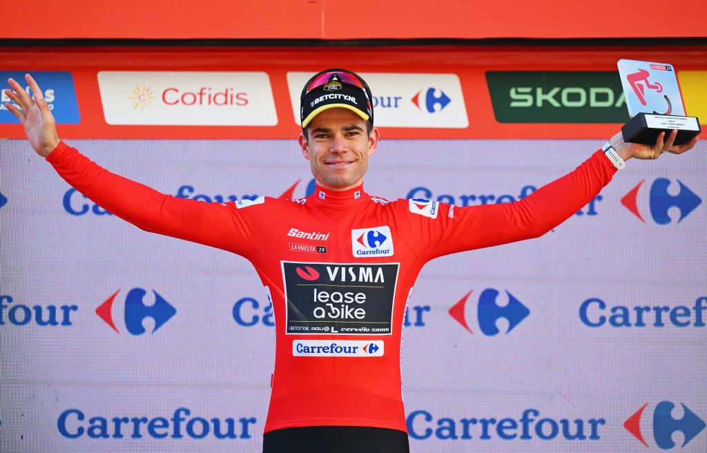 CASTELO BRANCO PORTUGAL AUGUST 19 Wout van Aert of Belgium and Team Visma Lease a Bike celebrates at podium as Red Leader Jersey winner after the La Vuelta 79th Tour of Spain 2024 Stage 3 a 1915km stage from Lousa to Castelo Branco UCIWT on August 19 2024 in Castelo Branco Portugal Photo by Tim de WaeleGetty Images