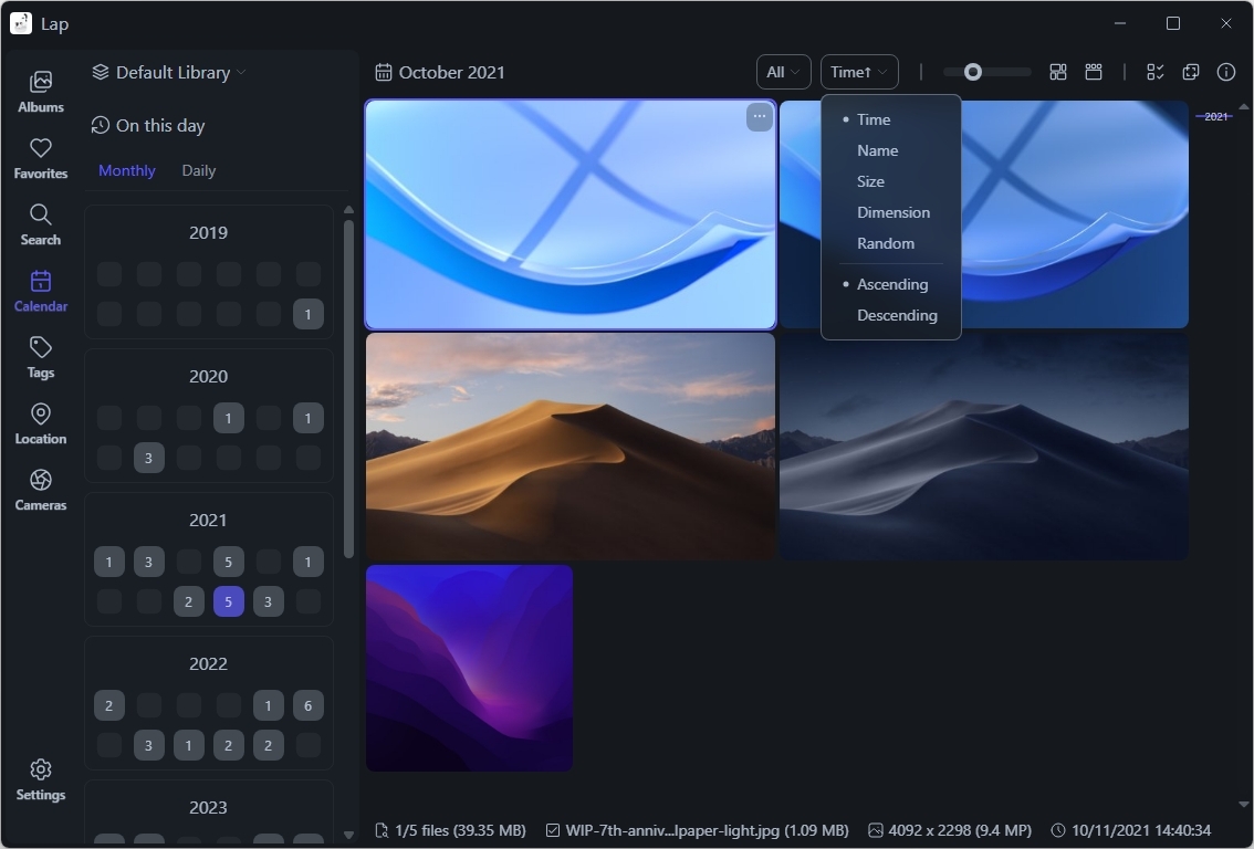 Dark-themed photo management interface showing a calendar, image previews, and sorting options. Displays serene landscape and abstract wallpapers.