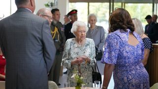 Queen Elizabeth II speaks to people during a visit to officially open the new building at Thames Hospice on July 15, 2022 in Maidenhead, England
