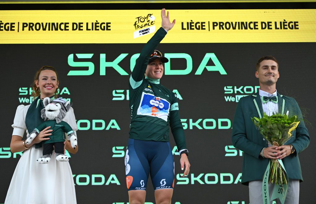 LIEGE BELGIUM AUGUST 14 Charlotte Kool of The Netherlands and Team dsmfirmenich PostNL Green Points Jersey celebrates at podium during the 3rd Tour de France Femmes 2024 Stage 4 a 1227km stage from Valkenburg to Liege UCIWWT on August 14 2024 in Liege Belgium Photo by Dario BelingheriGetty Images