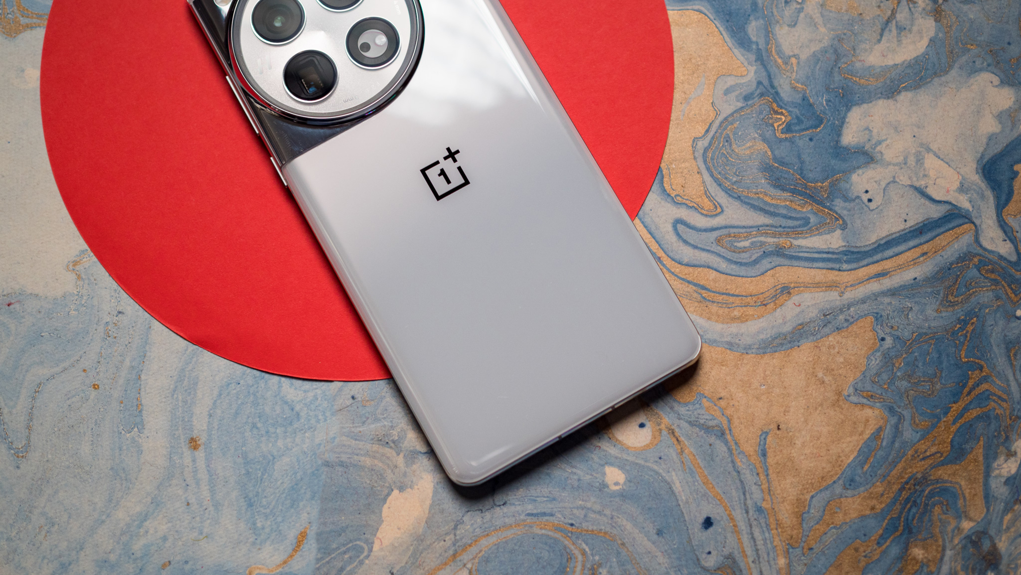 Back view of OnePlus 12 Glacial White showing glossy back