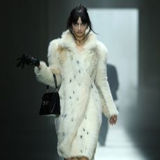 a model on the gucci fall 2026 fashion show runway