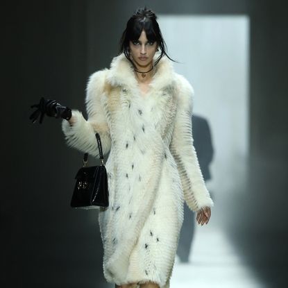 a model on the gucci fall 2026 fashion show runway