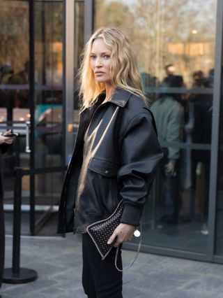 Kate Moss attends the Stella McCartney Womenswear Fall/Winter 2025-2026 show as part of Paris Fashion Week on March 05, 2025 in Paris, France wearing skinny jeans and platform mules