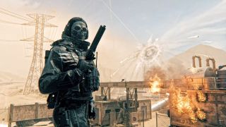 Call of Duty: Modern Warfare 3 multiplayer reveal, character operator with a skull mask and a revolver with explosions in the desert behind.