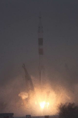 The Soyuz spacecraft carrying NASA astronaut Dan Burbank and Russian cosmonauts Anton Shkaplerov and Anatoly Ivanishin lifts off from the Baikonour Cosmodrome in Kazakhstan on Nov. 13, 2011 at 11:14 p.m. EST.