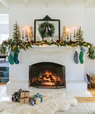 White living room with fireplace decorated for Christmas