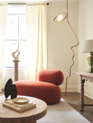 A living room corner with a floor lamp designed like a face