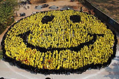 Students in Gwailor attempt to break the world record for largest human smiley face.