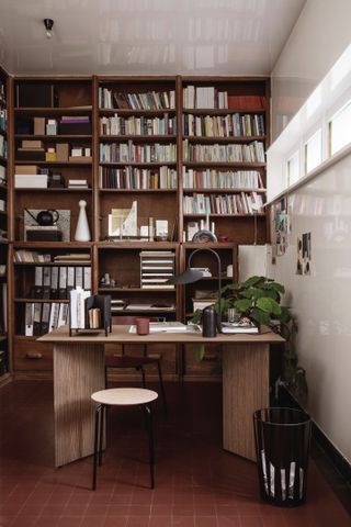 Wall of bookshelves in a home office