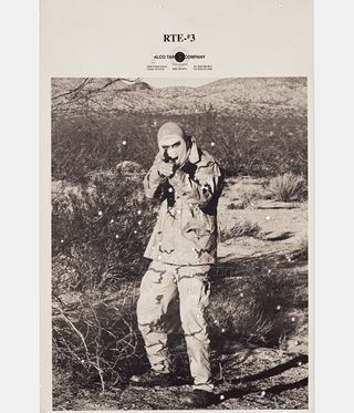 target picture of man in desert pointing a gun