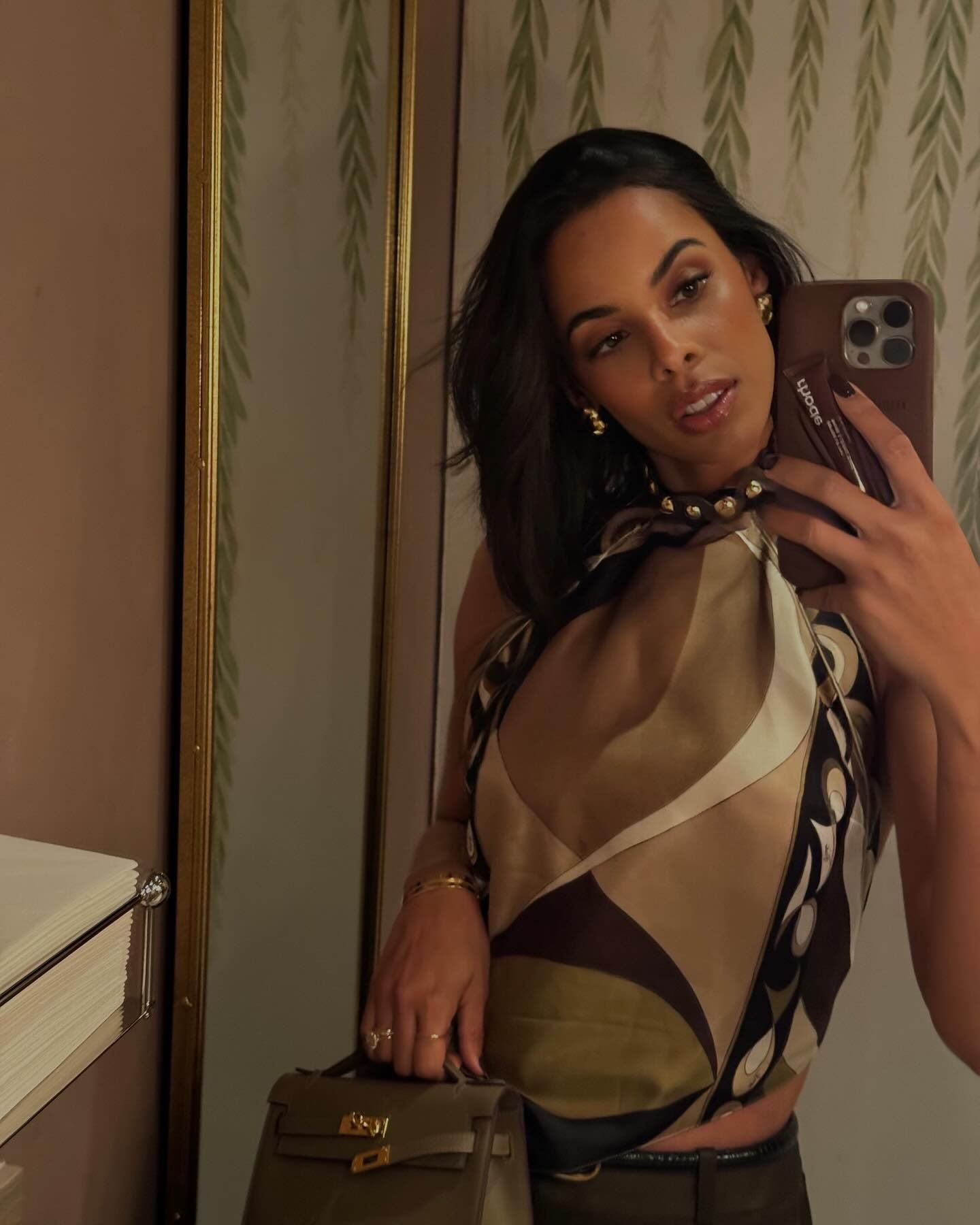 Rochelle Humes taking a mirror selfie with an asymmetrical bob