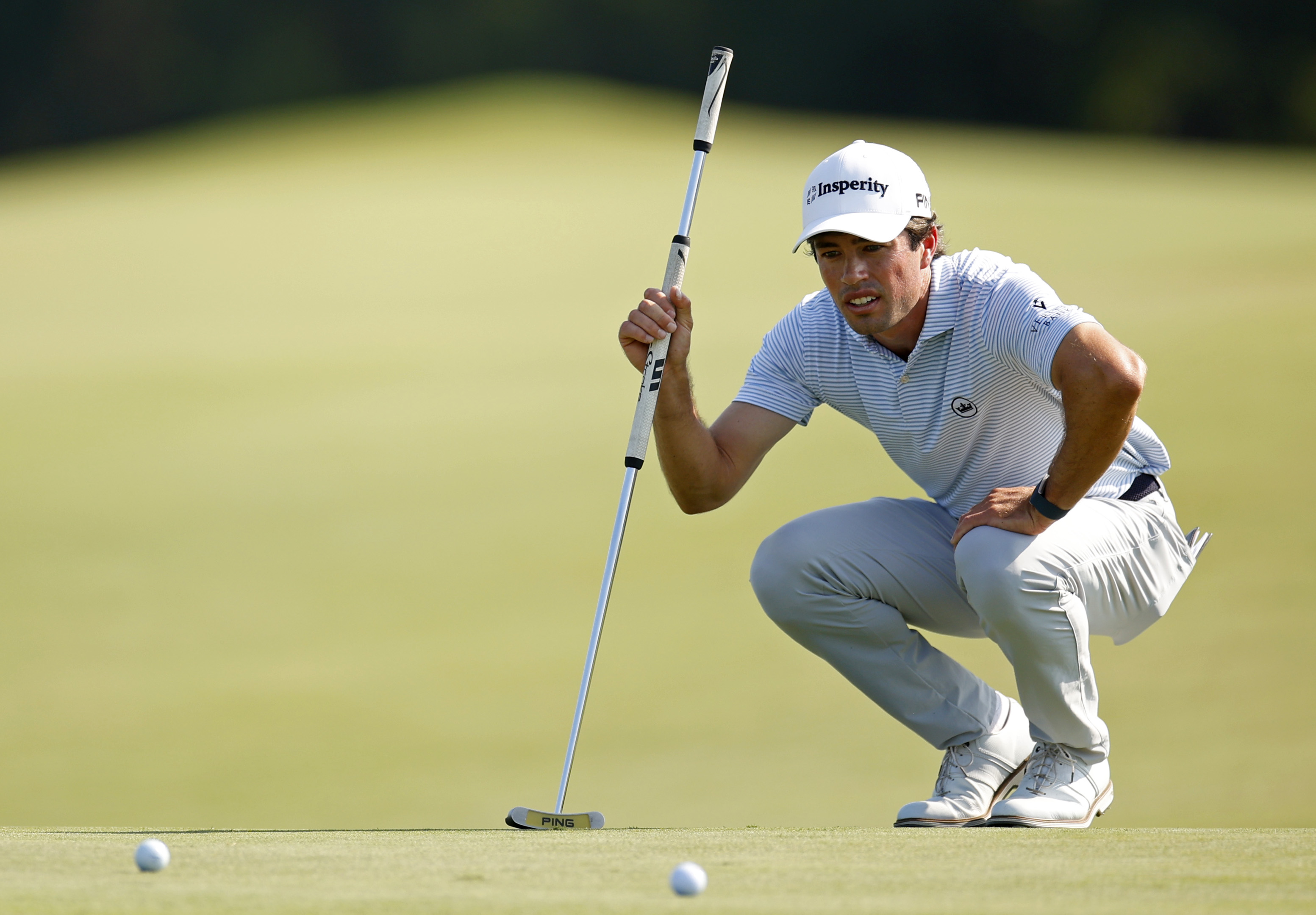 Cole Hammer lines up a putt