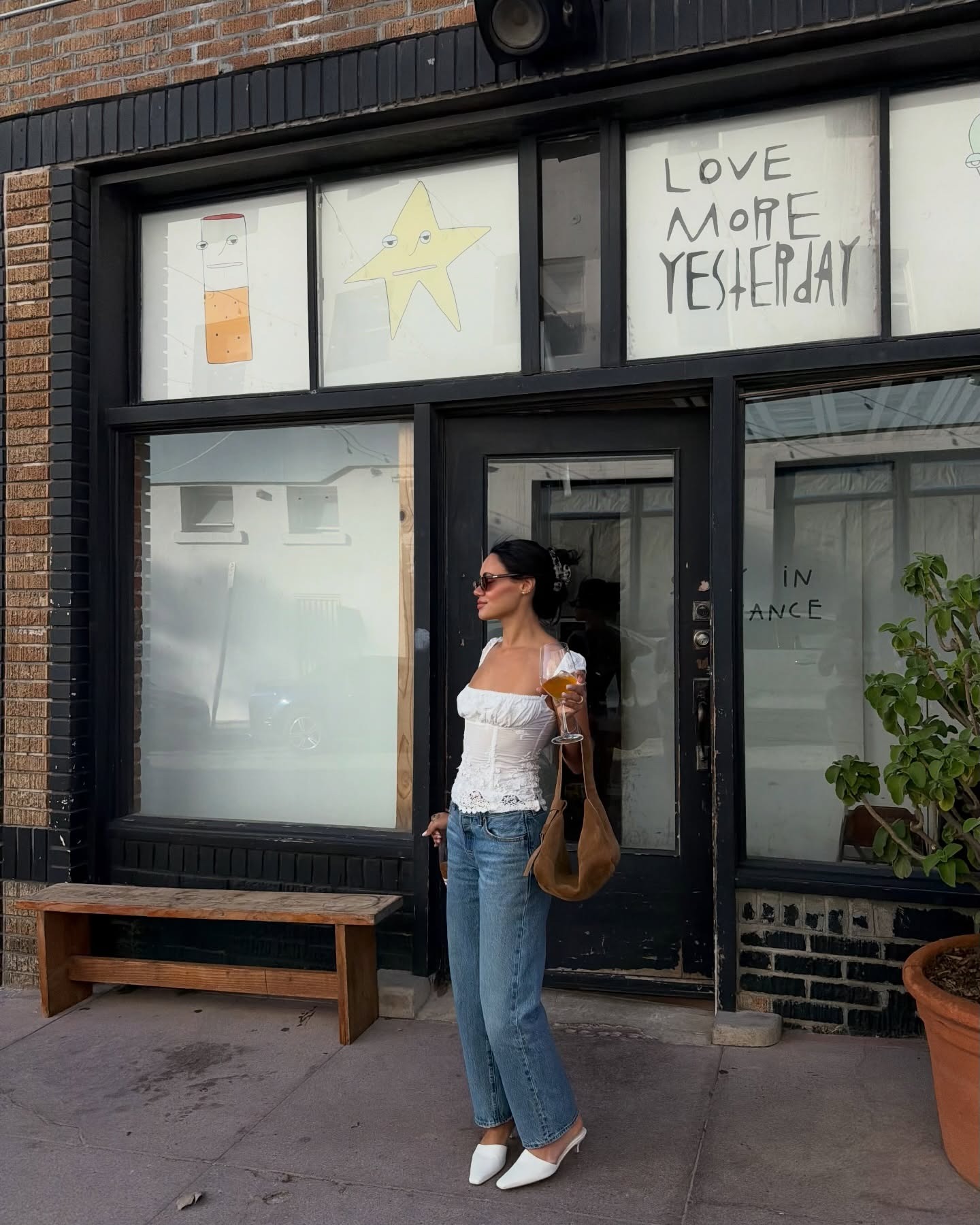 Woman in white top and jeans