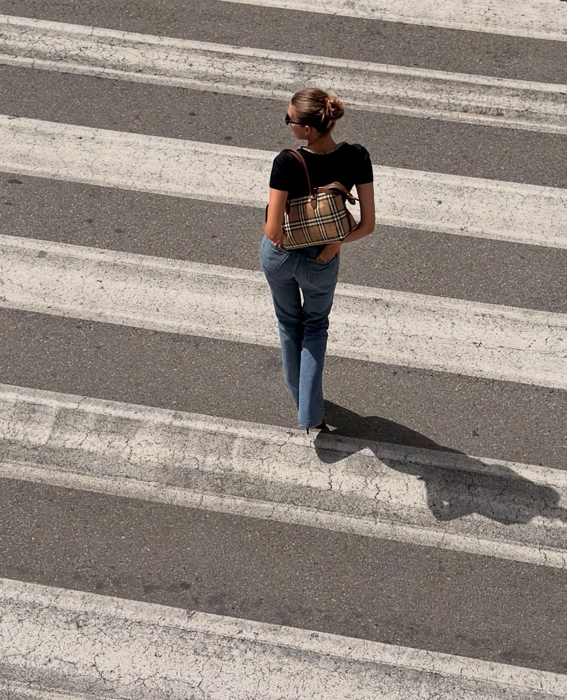 A woman wearing low rise bootcut jeans in 2026.