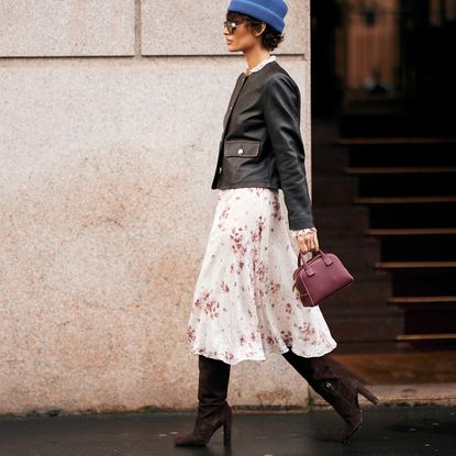 woman wearing fall boots and a long skirt
