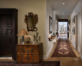 Ethnic inspired modern hallway design by interior design studio Marguerite Rodgers