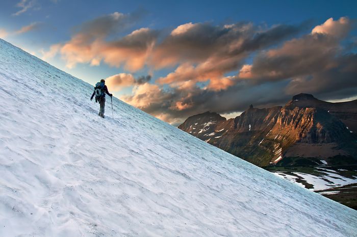 Glacier National Park is the perfect place for adventurous snow lovers. A recent photo captured a backpacker hiking the snowy mountain landscape.