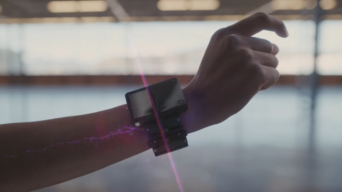 Meta&#039;s neural wristband prototype, a purple glow indicates nerve signals that the device registers using Electromyography