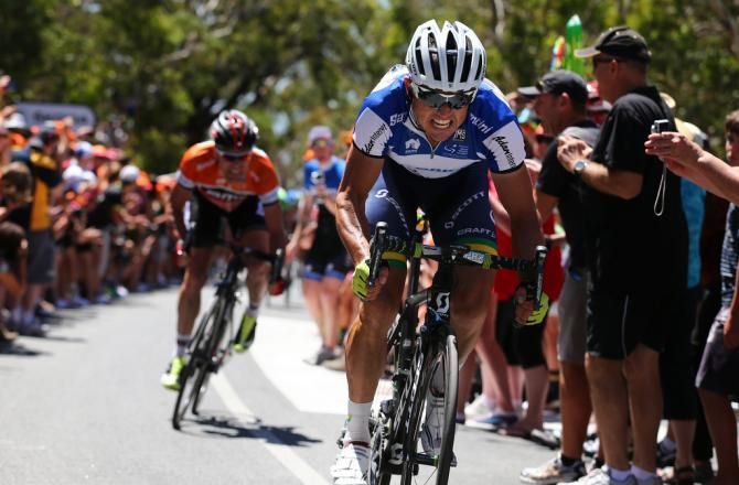 Simon Gerrans attacks to gain the one second he needed to dispose Cadel Evans of the race lead