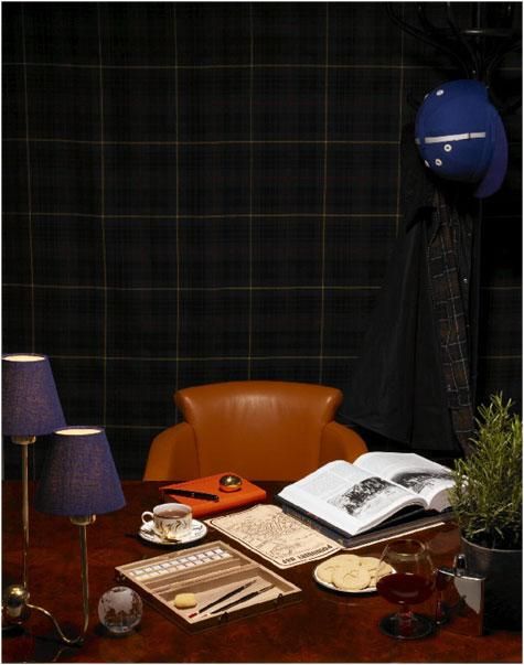 Desk with books and lamps, and plant