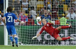 Italy's Andrea Pirlo chips a Panenka penalty over Joe Hart in a penalty shootout against England at Euro 2012.