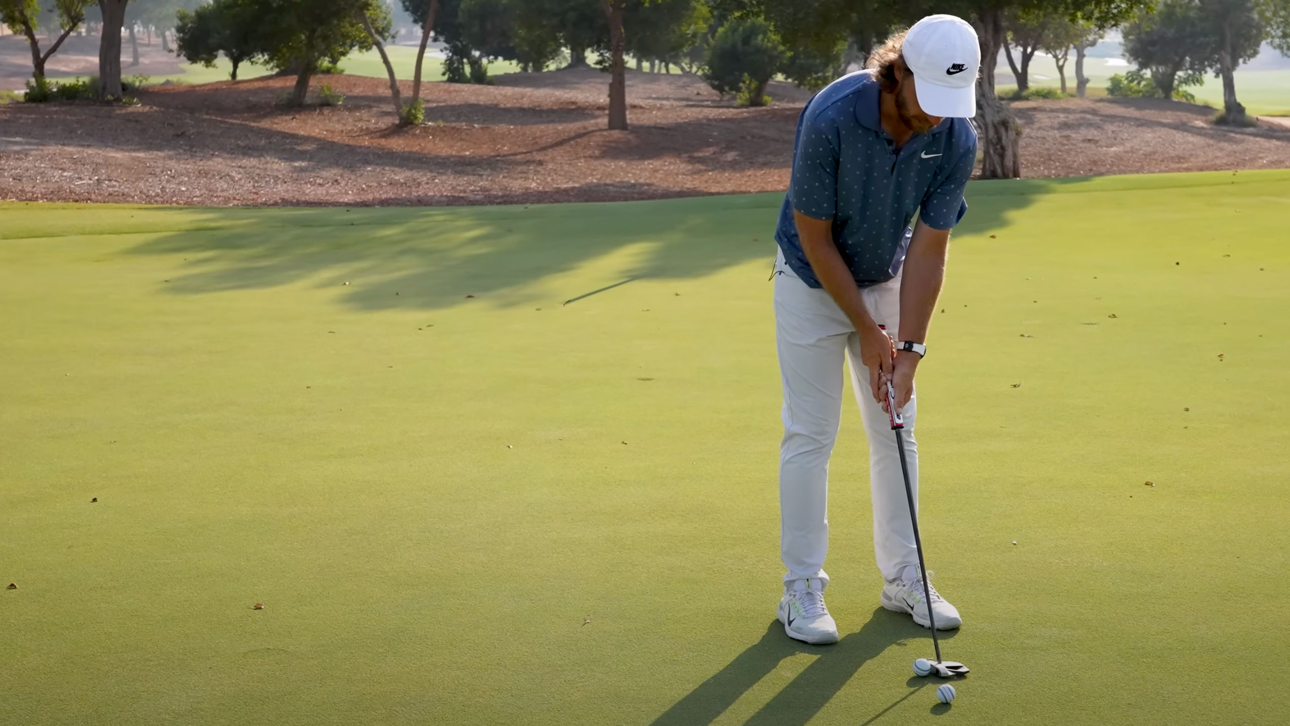 Photo of Tommy Fleetwood trying to putt left-handed