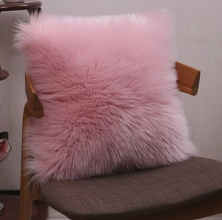 A super soft, fluffy pink pillow