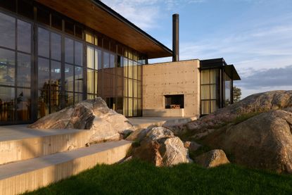 Dalarö house exterior seen sat on rocks from the side