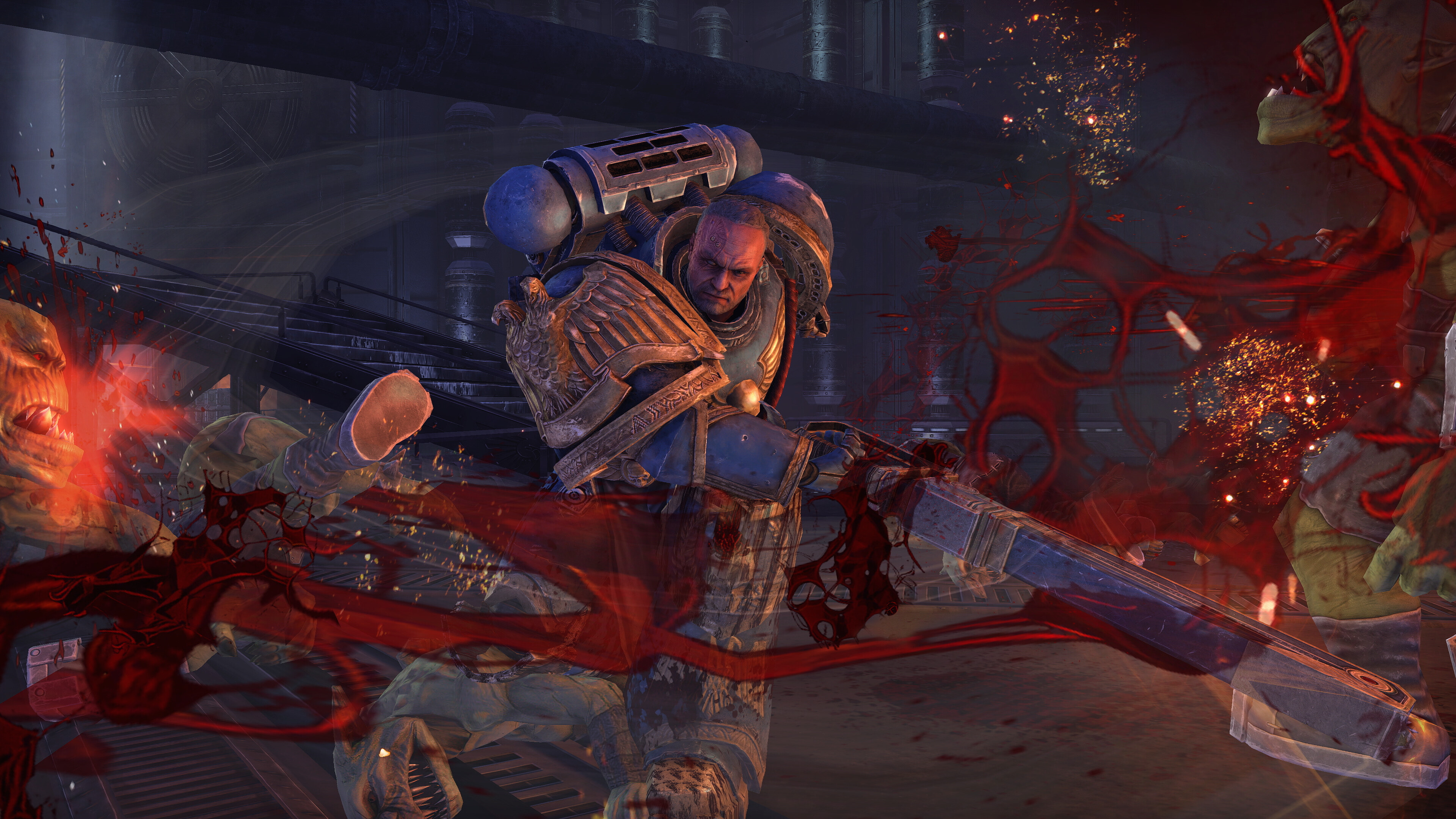 Promotional screenshot of a Space Marine killing Orks in Warhammer 40,000: Space Marine Master Crafted Edition.