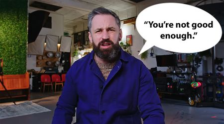 Screen shot from Scott Choucino video with Scott wearing a blue top in a photo studio with speech bubble saying "You're not good enough."