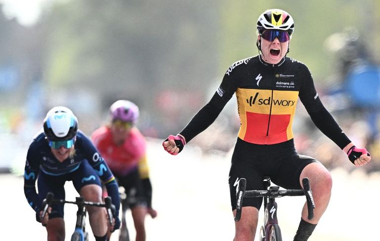 Lotte Kopecky (SDWorx) wins the 2022 Tour of Flanders wearing the Belgian national champion's jersey.